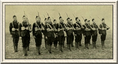 A squad of 'A' Company, 8th Battalion, Leicestershire Regiment, 'at
the slope' at Wokingham.