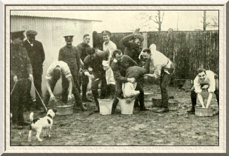 The lighter side of soldiering. The City of London Fusiliers assist
a comrade to take a bath.