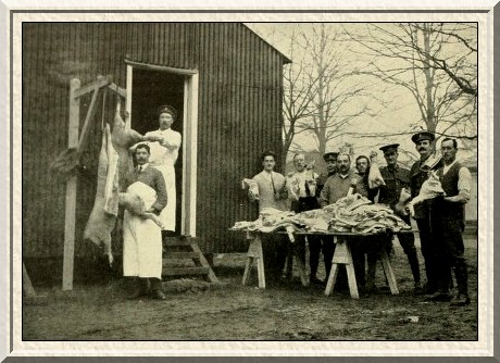 Camp butchers with the Sportsman's Battalion (Royal Fusiliers) cut
up the meat for dinner.
