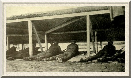 Shooting at a miniature rifle-range.