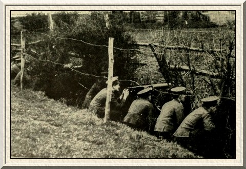 A machine-gun section taking cover in a ditch.