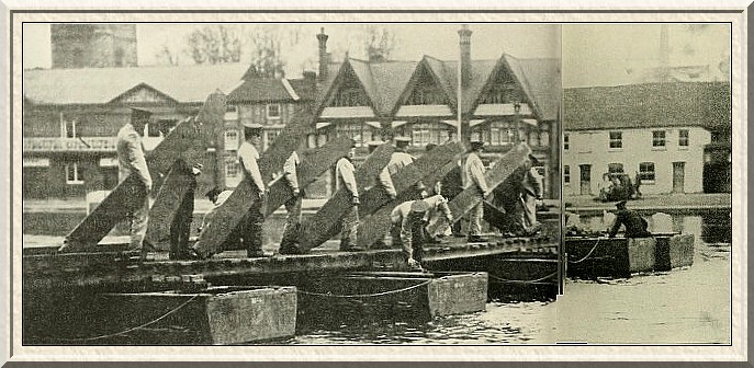 Engineers being given instruction at Henley in the method of
constructing a pontoon bridge.