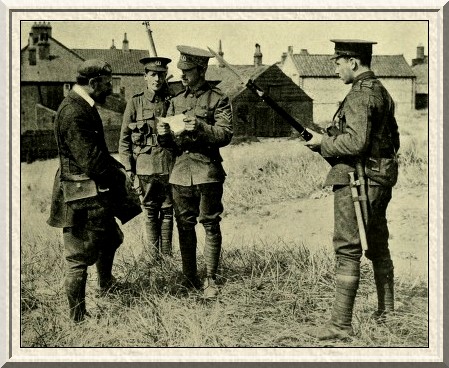 Under suspicion. A photographer is challenged by a sentry, and has
to undergo a searching cross-examination by a sergeant.