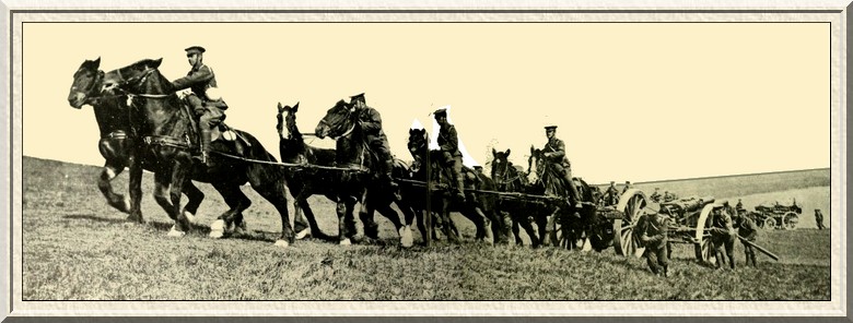 The field (howitzer battery) artillery bring their heavy guns up a
stiff slope—hard work for men and horses both.