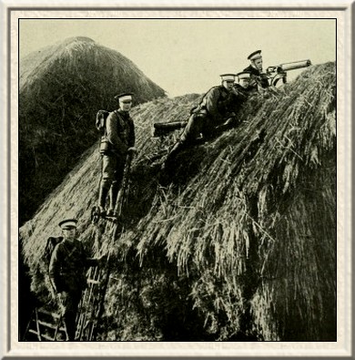 In the course of a mimic battle.—A machine-gun of the Royal
Berks in position on a hay-rick.