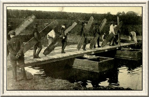 Men of the Royal Engineers building a pontoon bridge.