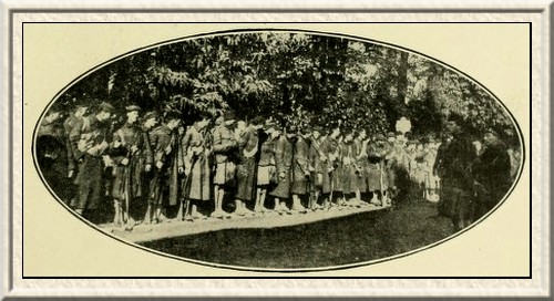 The London Scottish lining up for roll-call after their memorable
charge at Messines.